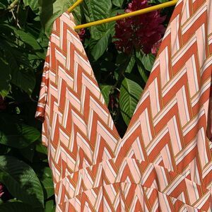 Geometric print jumpsuit with tiered flowy pants~